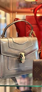 Silver top-handle bouquet handbag display